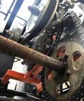 Forward Reverse Gearbox Kit For Go Karts With 11 To 18 HP Engines, showing chain and sprocket assembly on off-road vehicle