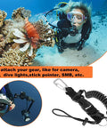 Scuba Diving Coil Lanyard With Stainless Steel Spring Clip And Quick Release Buckle For Underwater Gear Like Flashlights And Cameras TPU Coated Cable Anti Corrosion Heavy Duty Built For Freediving next to diver underwater