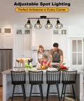 4 Light Track Lighting Fixture in Black Industrial Style with Open Wire Cage illuminating a modern kitchen with adjustable spotlights