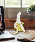 Banana Shaped Table Lamp With LED Night Light Modern Resin Banana Lighting Fixture for home office, next to laptop on desk