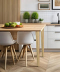 Premium Solid Wood Table Legs 28 Inches Tall Natural Finish used in modern kitchen with white chairs and wood details.
