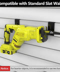 Heavy Duty Slatwall Hooks 20 Pack With Beefed Up Backplate securing yellow power tool on slat wall in garage organizer system