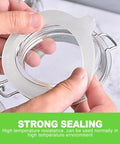 Hands holding Eight Pack Silicone Canning Jar Seals With Airtight Reusable Gaskets crafted for Standard Mouth Mason lids.