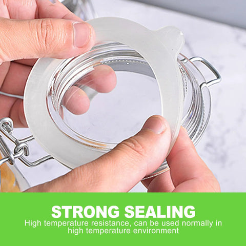 Hands holding Eight Pack Silicone Canning Jar Seals With Airtight Reusable Gaskets crafted for Standard Mouth Mason lids.