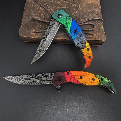 Colorful Eagle Head Embossed Folding Pocket Knife With Damascus Pattern Blade EDC Everyday Carry Utility Knife For Camping And Daily Unpacking Lightweight Decorative Carry Knife For Collectors And Gift showing open blades, colorful handles.