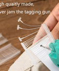 Close-up of clear tagging gun fasteners in use, part of Five Thousand Pcs One Inch Tagging Gun Fasteners Not Jam Refill