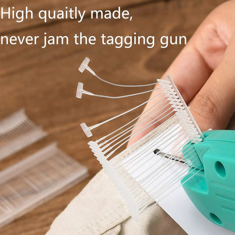 Close-up of clear tagging gun fasteners in use, part of Five Thousand Pcs One Inch Tagging Gun Fasteners Not Jam Refill