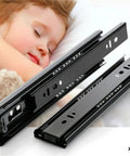 Stainless Steel Drawer Slide 10 To 20 Inch Soft Close Three-Section Cabinet Track Rail shown against a peaceful sleeping child.
