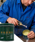 Person using torch on Nozzle Cleaner Gel 200g for Welding Spatter and Flux Removal container in workshop.