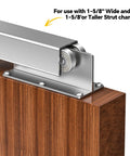 Pro Grade Strut Channel Trolleys Pack Of Four With Slick Metal Casters For Tough Barn Door Slides and Garage Rail Hardware Silver Finish. Close-up view of trolley on wooden surface.