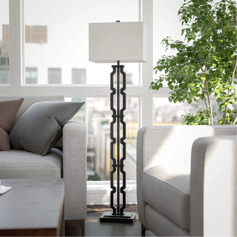 Tall Black Floor Lamp With White Rectangular Shade, 59.5 Inch Height, 16 Inch Width, 9 Inch Extension placed by a window