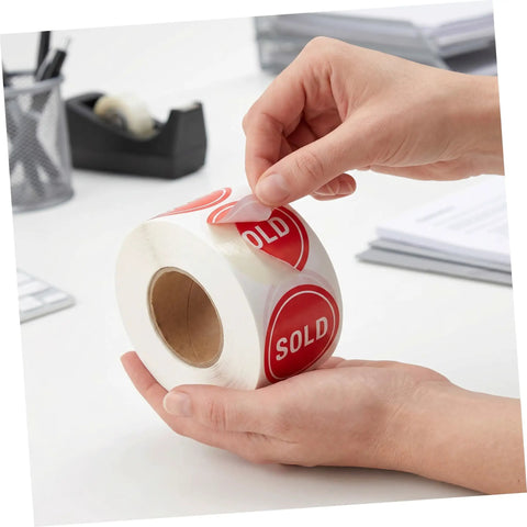 Red Round Self Adhesive Sold Stickers Two Inch Paper Labels For Retail Store And Warehouse Inventory Control Pricing Supplies 500 Pack With Strong Adhesion And Uniform Appearance For Clear Tagging And Easy Price Updates. hands peeling red sold paper labels roll
