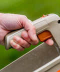 Person holding No Crank One Touch Battery Powered Spreader For Fertilizer Seed And Ice Handheld Spreader With EdgeGuard Tech