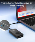 Premium M2 NVMe SSD Enclosure With Built In Cooling Fan Thunderbolt 5 4 3 And USB4 Compatible connected to a laptop.