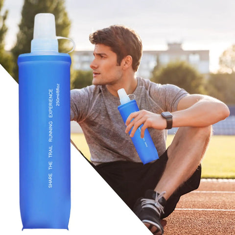 Ultra Lightweight Foldable Water Bottle For Hiking And Outdoor Adventures with man sitting and holding blue pouch