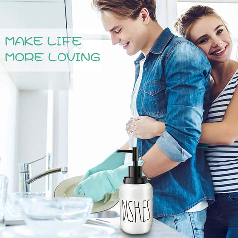 Couple washing dishes with Farmhouse Ceramic Soap Dispenser With White Glaze, Bold Black Pump And Lettering, 14oz on counter