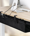 Under Desk Cable Management Tray Clamp On Wire Organizer in a clean home office, black fabric design, installed under desk with cords