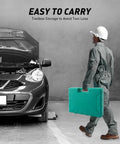 Person carrying tool case next to car with open hood. Easy to carry the 9 Piece Auto Body Hammer And Dolly Kit For DIY Dent Repair.