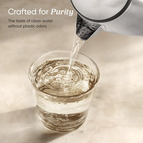 Plastic Free Interior Electric Kettle With 304 Stainless Steel pouring water into glass