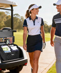 Dual Layer Golf Trunk Organizer With Ventilated Shoe Compartment For Two Pairs Of Shoes in golf cart with two golfers nearby