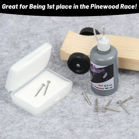 Derby Car Kit With Eight Pinewood Axles And 40ml Graphite Lubricant Powder on grey surface with box and bottle