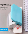 Top view of the Handy 6 Hole Puncher For A4 A5 B5 Notebooks And Scrapbooks in green, showing storage structure next to loose-leaf pages.
