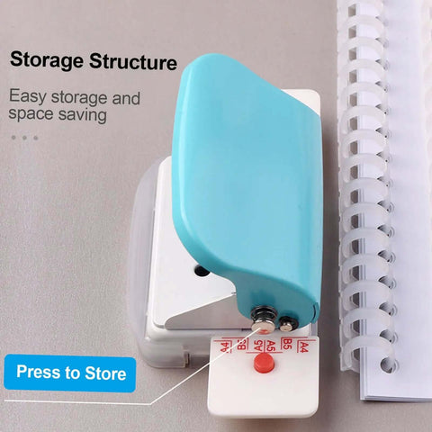 Top view of the Handy 6 Hole Puncher For A4 A5 B5 Notebooks And Scrapbooks in green, showing storage structure next to loose-leaf pages.