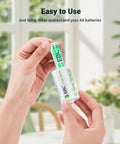 Hand inserting AA battery into AA To D Size Battery Adapter Spacers 4 Pack For Rechargeable AA Batteries D Size Converter Case Durable