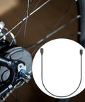 Bicycle Derailleur Shifting Cable Charger For Di2 12 Speed Electronic Shifting 150 CM Type C Cable beside bike wheel