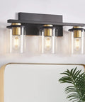 3-Light Black And Gold Bathroom Vanity Lights With Glass Cylinder Sconces For Wall Mounted Bathroom Lighting, above mirror