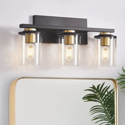 3-Light Black And Gold Bathroom Vanity Lights With Glass Cylinder Sconces For Wall Mounted Bathroom Lighting, above mirror