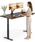 Straight Up Premium Motorized Height Adjustable Standing Desk With Heavy Duty Matte Black Frame And Legit Solid North American Black Walnut Desktop, shown in a home office setup.