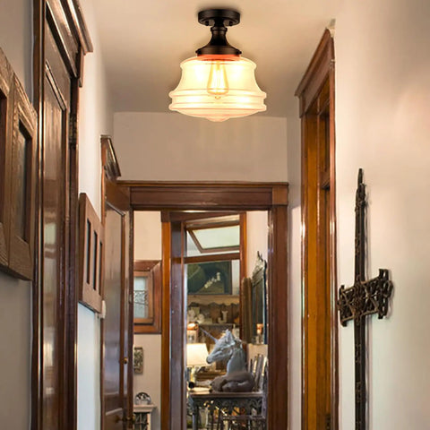 Industrial Black Semi Flush Mount Ceiling Light with Clear Glass Fixture 11 Inch Schoolhouse Style in a cozy hallway.