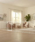 Ultra Wide Baby Gate And Play Yard For Kid And Pet Friendly Homes Nearly 16 Feet Long Two In One Convertible Safety Barrier Hardware Mounted For Toddlers And Pets Tested And Trusted For 30 Years American Designed And Owned White installed in living room.