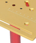 Close-up of gold manual router lift plate with measurement markings, part of Dead Nuts Accurate Manual Router Uplift System.