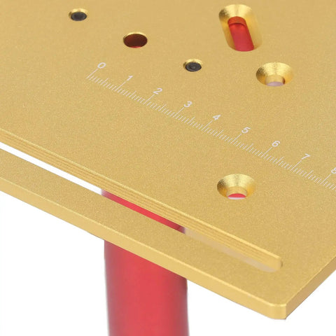 Close-up of gold manual router lift plate with measurement markings, part of Dead Nuts Accurate Manual Router Uplift System.