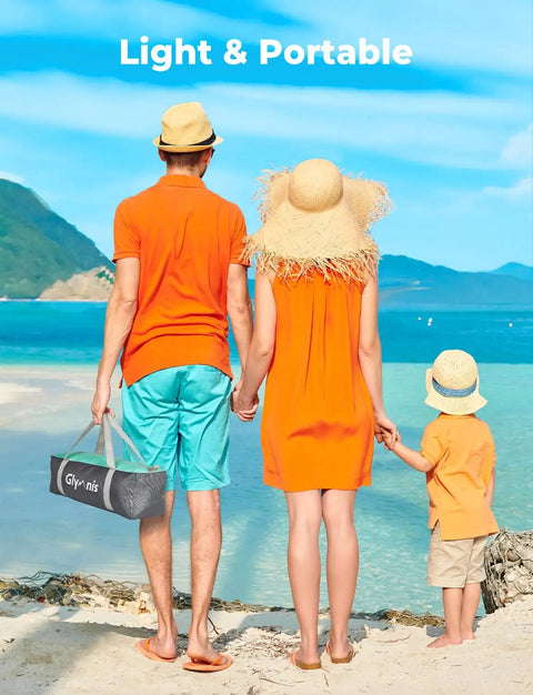 Family on beach holding Beach Day Ready Sun Shelter For Three People With UPF Fifty Plus UV Protection Lightweight Easy Setup Shade Canopy.