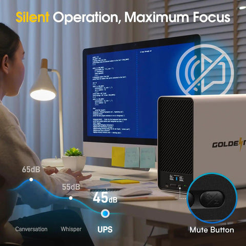 Person at desk using computer with LiFePO4 Lithium UPS Battery Backup And Surge Protector For Home And Office next to monitor