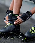 Person securing Macroblade 80 Inline Skates For Men Casual Skating And Entry Level Training With High Cuff Support Black And Lime