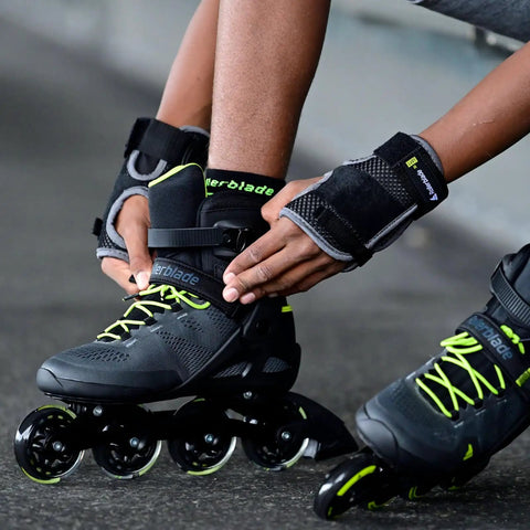 Person securing Macroblade 80 Inline Skates For Men Casual Skating And Entry Level Training With High Cuff Support Black And Lime