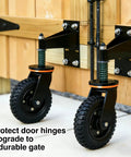 Eight Inch Heavy Duty Gate Rollers Two Pack, Tough As Nails Seven Five Zero Pound Swivel Casters For Wood Or Pipe Fences, showing installed black rollers on a wooden gate.