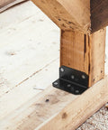 Rock Solid 2X4 Galvanized Corner Braces Heavy Duty L Bracket mounted on wood for framing support and stability.