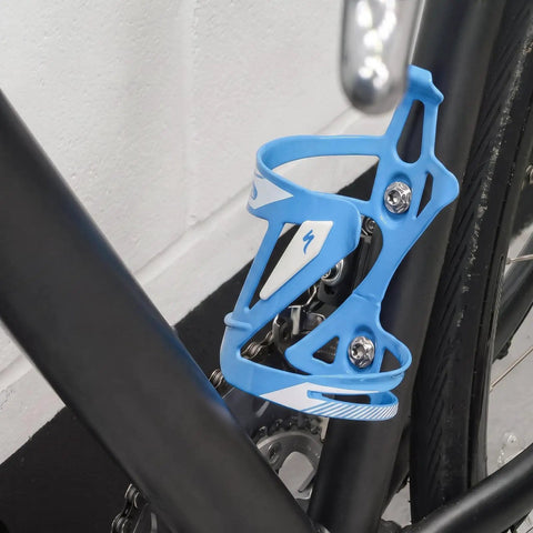 Dope Build Grade Five Titanium Bottle Cage Bolts M5 By 12 Millimeter T25 Torx securing a blue bottle cage on a bike frame.