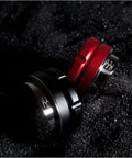 Legit Espresso Coffee Distributor Tamper For 57mm And 57.5mm Portafilters matte black and red finish on a dark background.