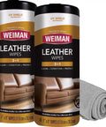 Top Shelf Leather Cleaner And Conditioner Wipes With Cloth Scrub Out Stubborn Grime, two canisters next to a rolled gray cloth.