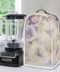 Watercolor Floral Blender And Stand Mixer Cover Protects Your No Fuss Home Kitchen Small Appliance From Dust Proof Fingerprints And Scratches Durable Polyester Protector Easy To Clean next to a standard black blender