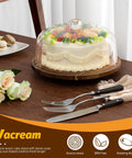 Heavy Duty Acacia Wood Cake Stand With Lid And Rotating Lazy Susan Tray, cake with transparent cover on wooden base.