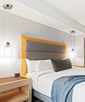 Three Pack Industrial Pendant Lights For Kitchen Island And Living Areas in bedroom with clear glass shades, over bedside tables.