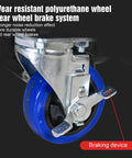 Close-up of blue caster wheel with brake lever on metal frame of hydraulic lift trolley