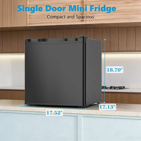 Slick 1.6 Cubic Foot Compact Mini Fridge With Freezer And Small Upright Kitchen Unit For Bedroom Dorm Or Office in black on a kitchen counter.
